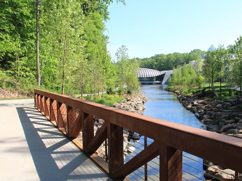West Walkway Paved trail along pond with museum building in background