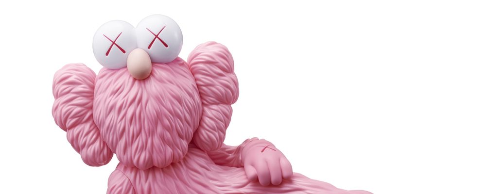 Stylized pink puppet-like figure with red X eyes and furry texture on a white background.