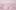 Gold text printed on pink paper, showing part of a letter featured in the Dear Friend exhibition. The words 