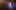 row of fabric banners hanging from wall with soft light shinning through