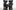 Four black sculptures depicting a family by the artist KAWS.