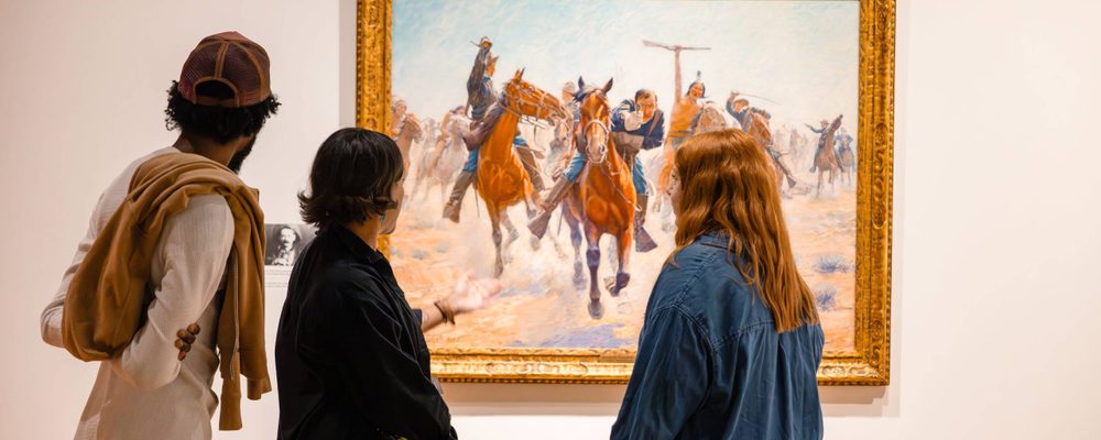 Knowing the West Three people view a work in 'Knowing the West' at Crystal Bridges.