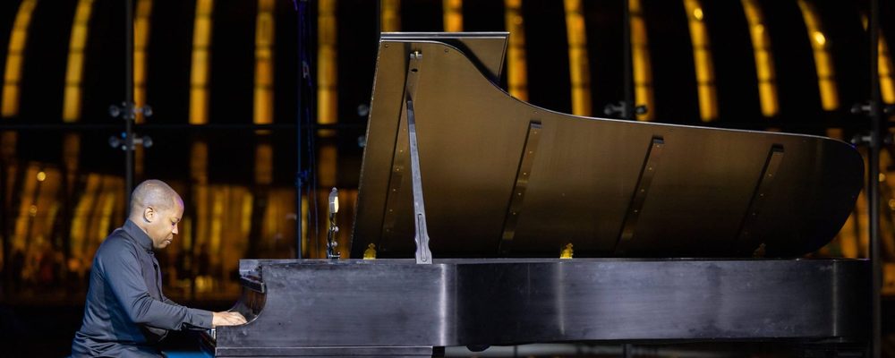 Van Cliburn Concert Series Masthead A man sitting at the Van Cliburn piano in the Crystal Bridges Great Hall