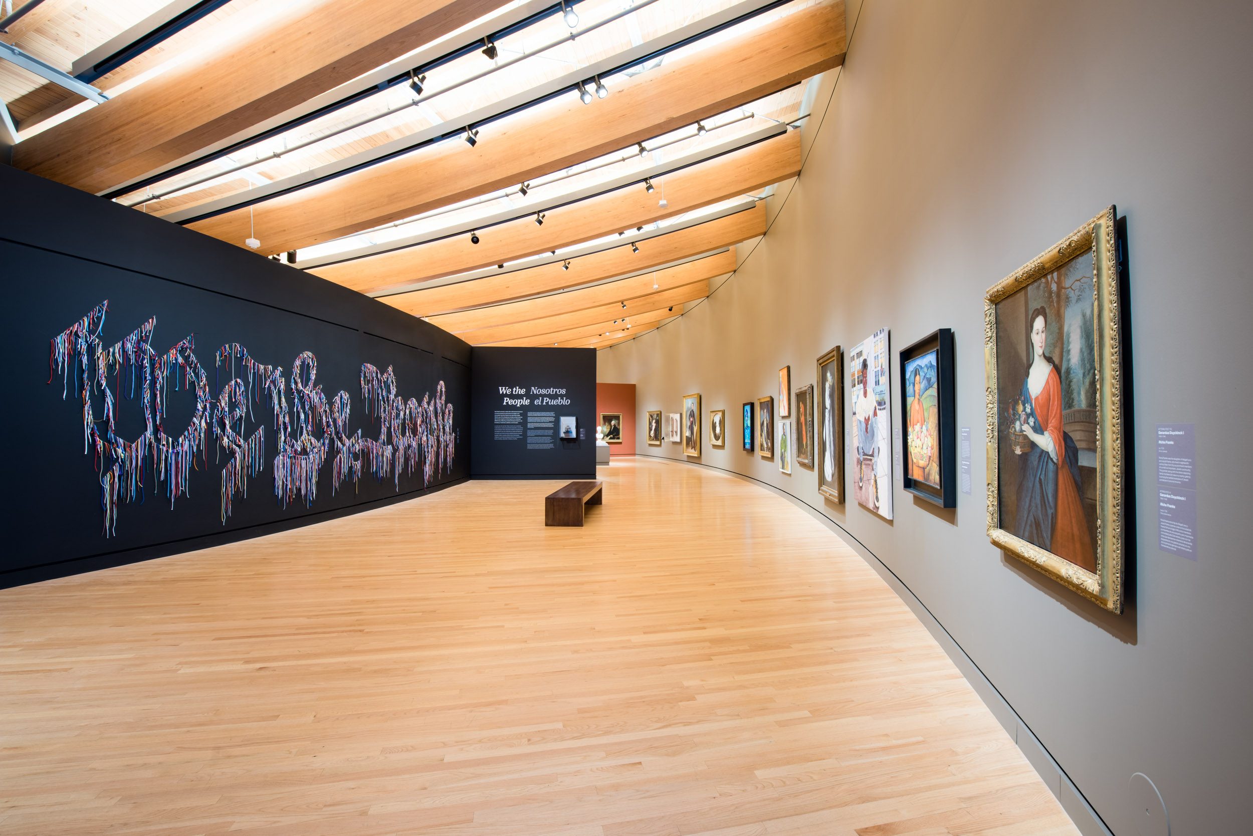 Early American Art Gallery, Crystal Bridges Art gallery with curved wood ceiling, framed paintings, and