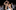 En Fuego Dance and Fitness Woman in white hat dancing with partner in brown shirt
